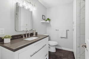 Bathroom featuring vanity and a closet