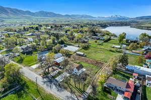Aerial view of residential area featuring a water and mountain view
