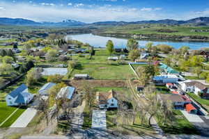 Aerial view of residential area featuring a water and mountain view