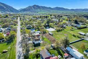 Aerial perspective of suburban area featuring a mountain backdrop