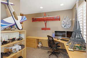 Home office featuring light colored carpet and recessed lighting