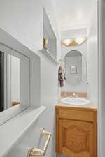 Half bathroom featuring vanity