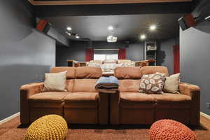 Home theater with carpet floors and recessed lighting