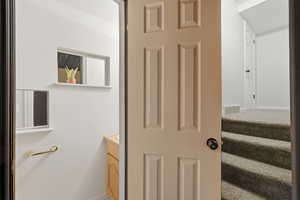 Bathroom featuring vanity and baseboards
