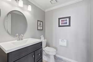 Bathroom featuring vanity and ornamental molding