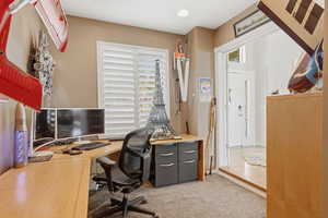 Office space with light colored carpet