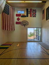 Indoor court featuring hardwood flooring with court markings
