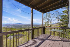 Wooden terrace featuring a mountain view