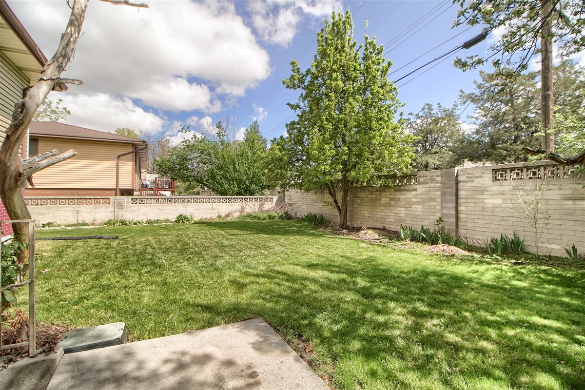 Fenced backyard featuring a patio area