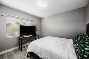 Bedroom #3 upstairs, with baseboards and LVP flooring