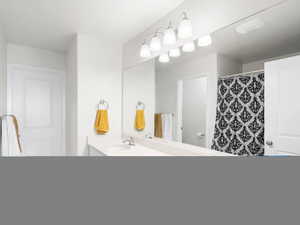 Full bath featuring double vanity and curtained shower
