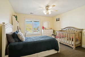 Bedroom with carpet and a ceiling fan