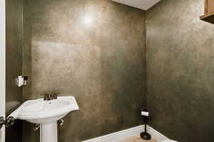 Bathroom featuring baseboards