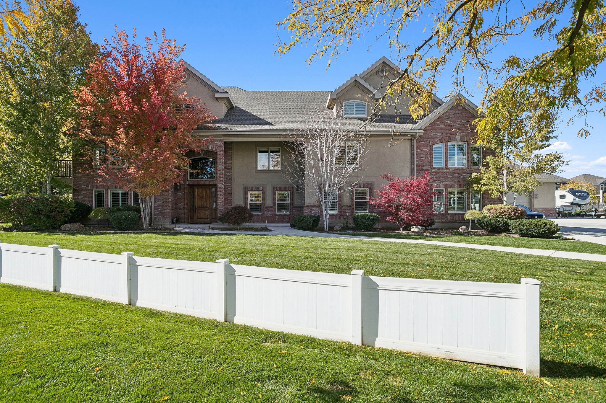 View of front of house featuring brick siding, a porch, and a shingled roof