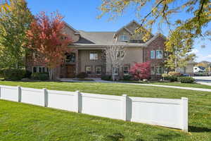 View of front of house featuring brick siding, a porch, and a shingled roof