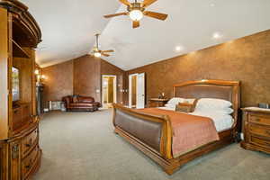 Bedroom featuring lofted ceiling, carpet flooring, and ceiling fan