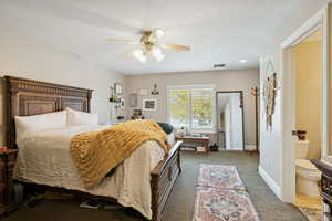 Carpeted bedroom featuring ceiling fan and recessed lighting
