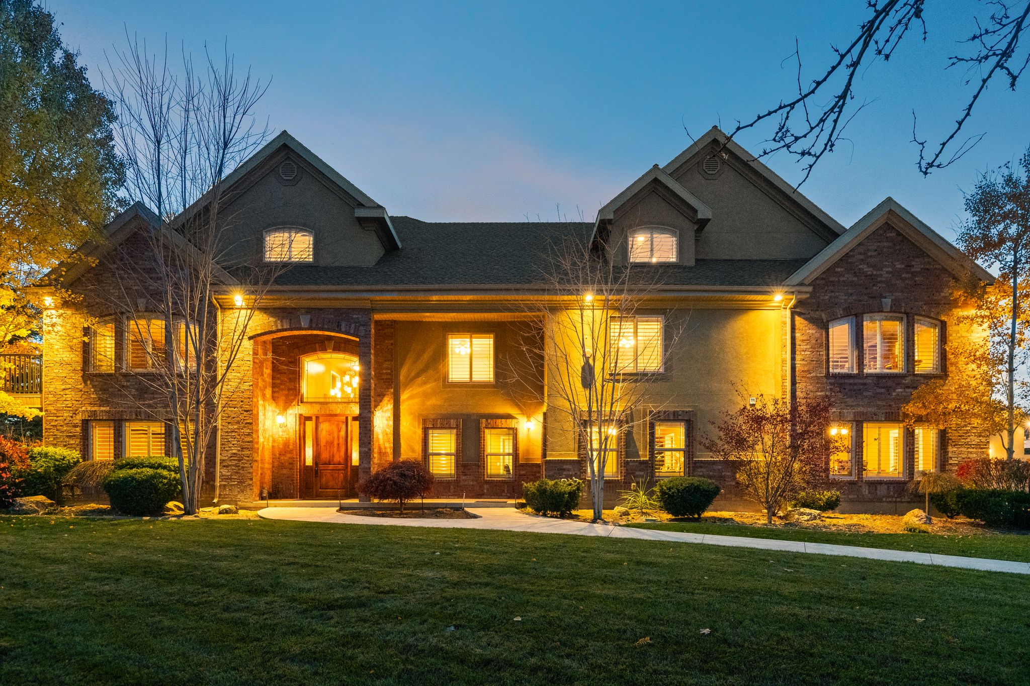 View of front of property with a porch and a front lawn