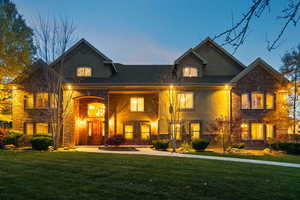 View of front of property with a porch and a front lawn