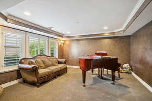 Carpeted home office featuring crown molding, a tray ceiling, a textured ceiling, and recessed lighting