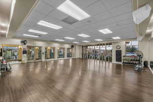 Exercise room featuring a drop ceiling