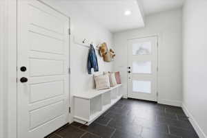 Mudroom featuring baseboards and recessed lighting
