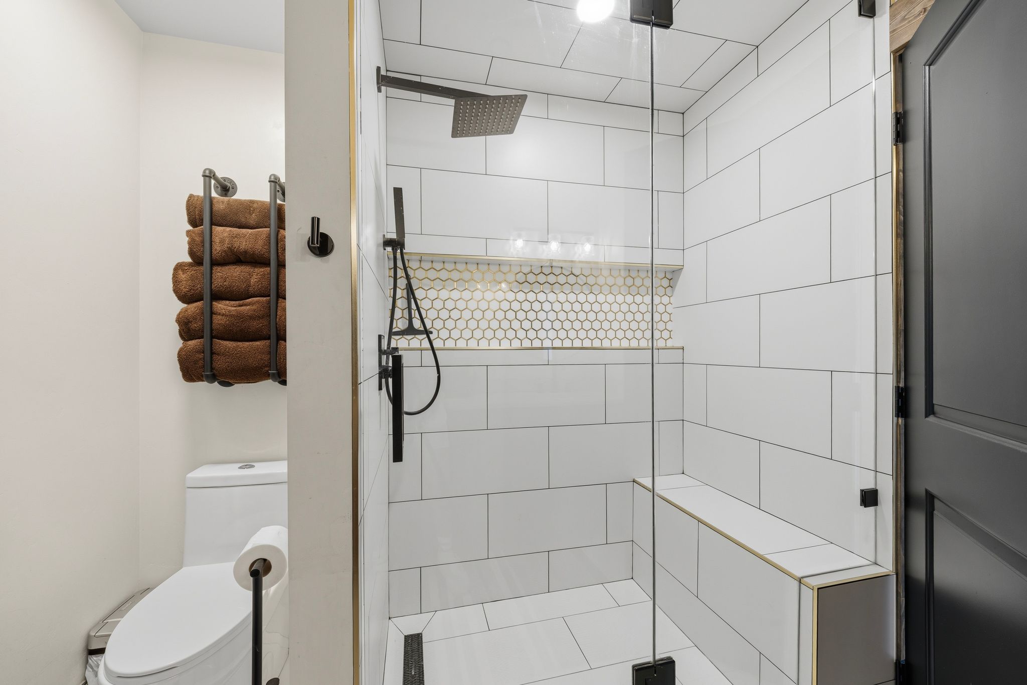 Bathroom with a stall shower and toilet