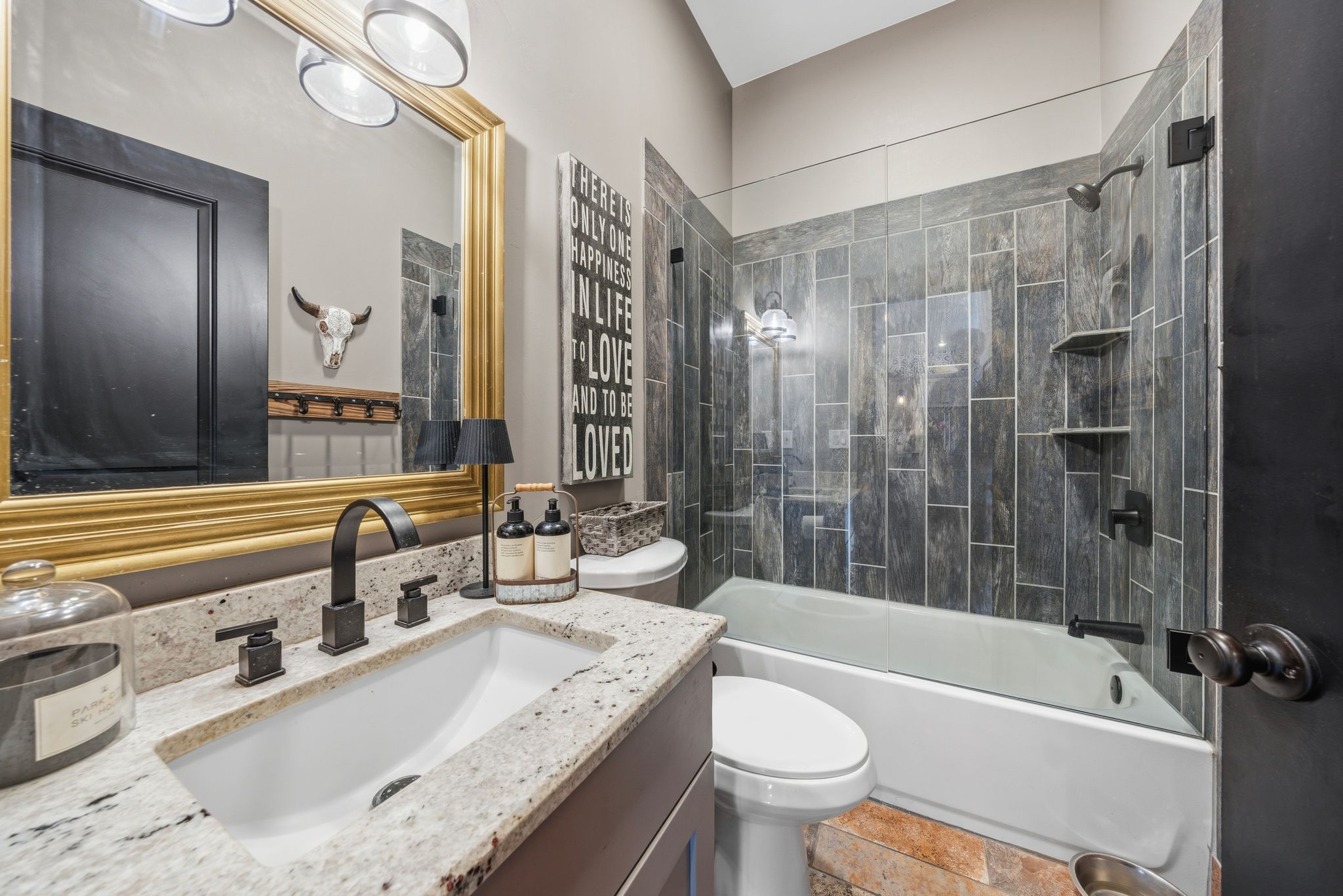 Bathroom featuring  shower combination and vanity
