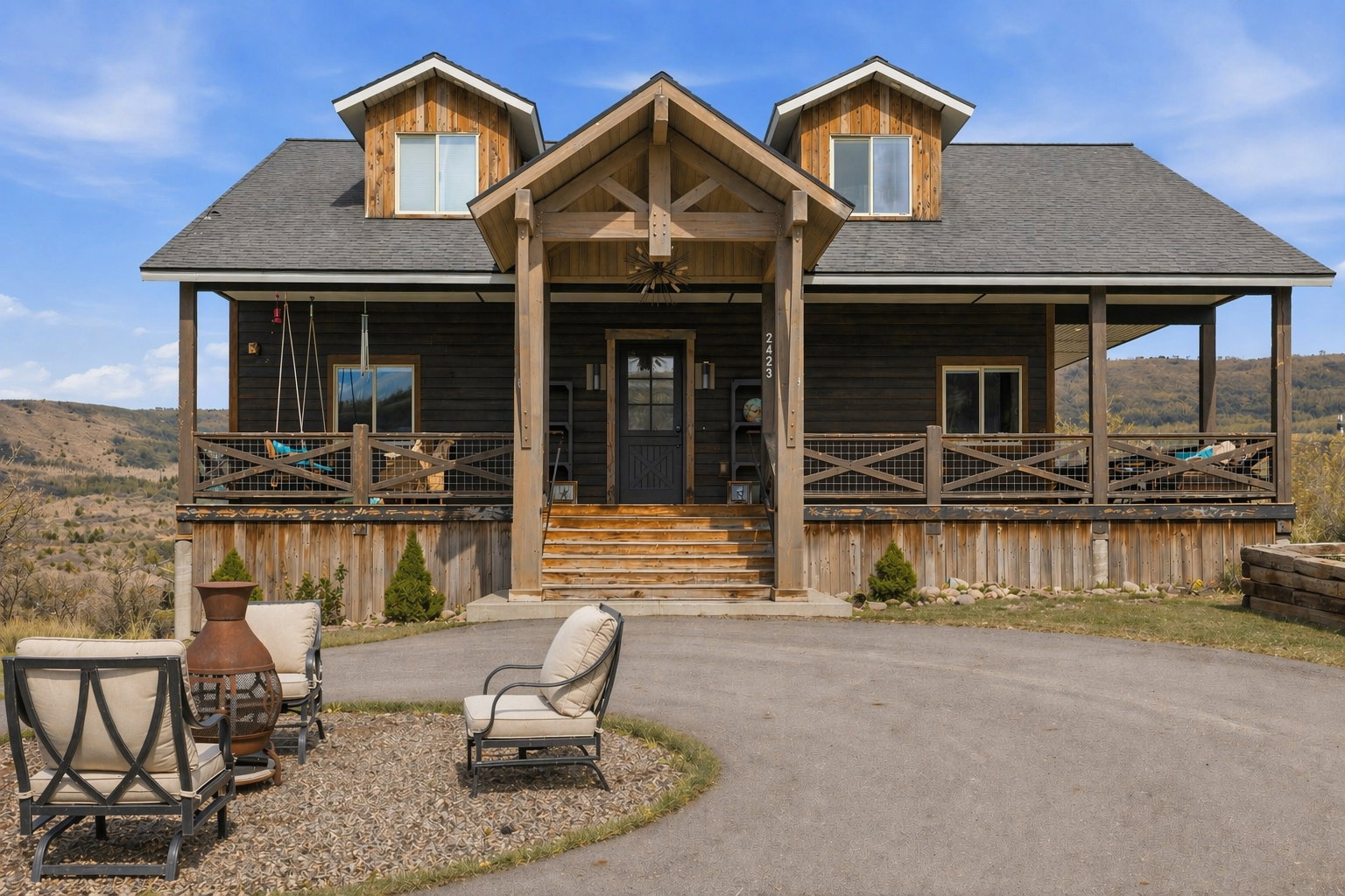 View of front of property with roof with shingles and a porch