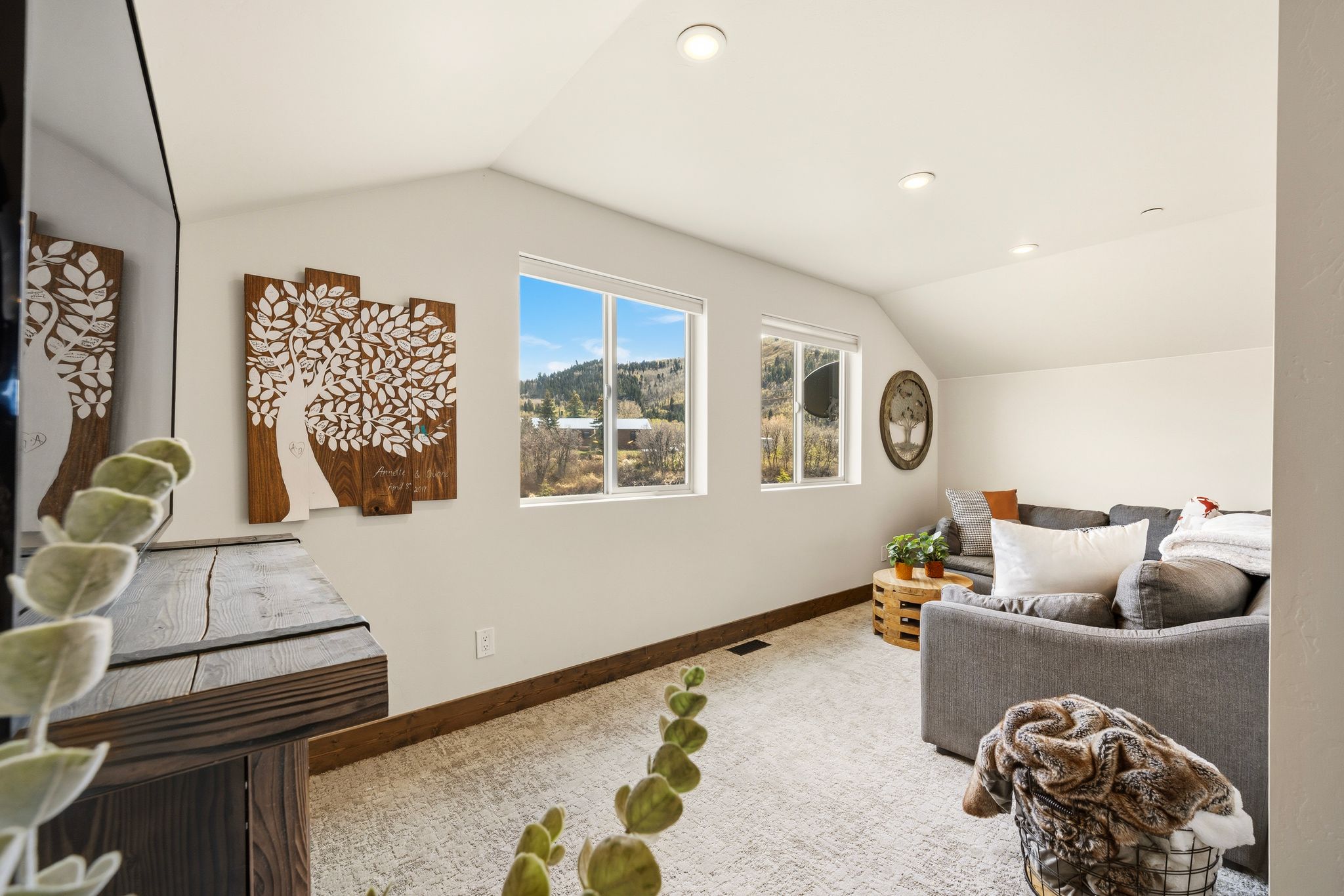 Living area with carpet and recessed lighting