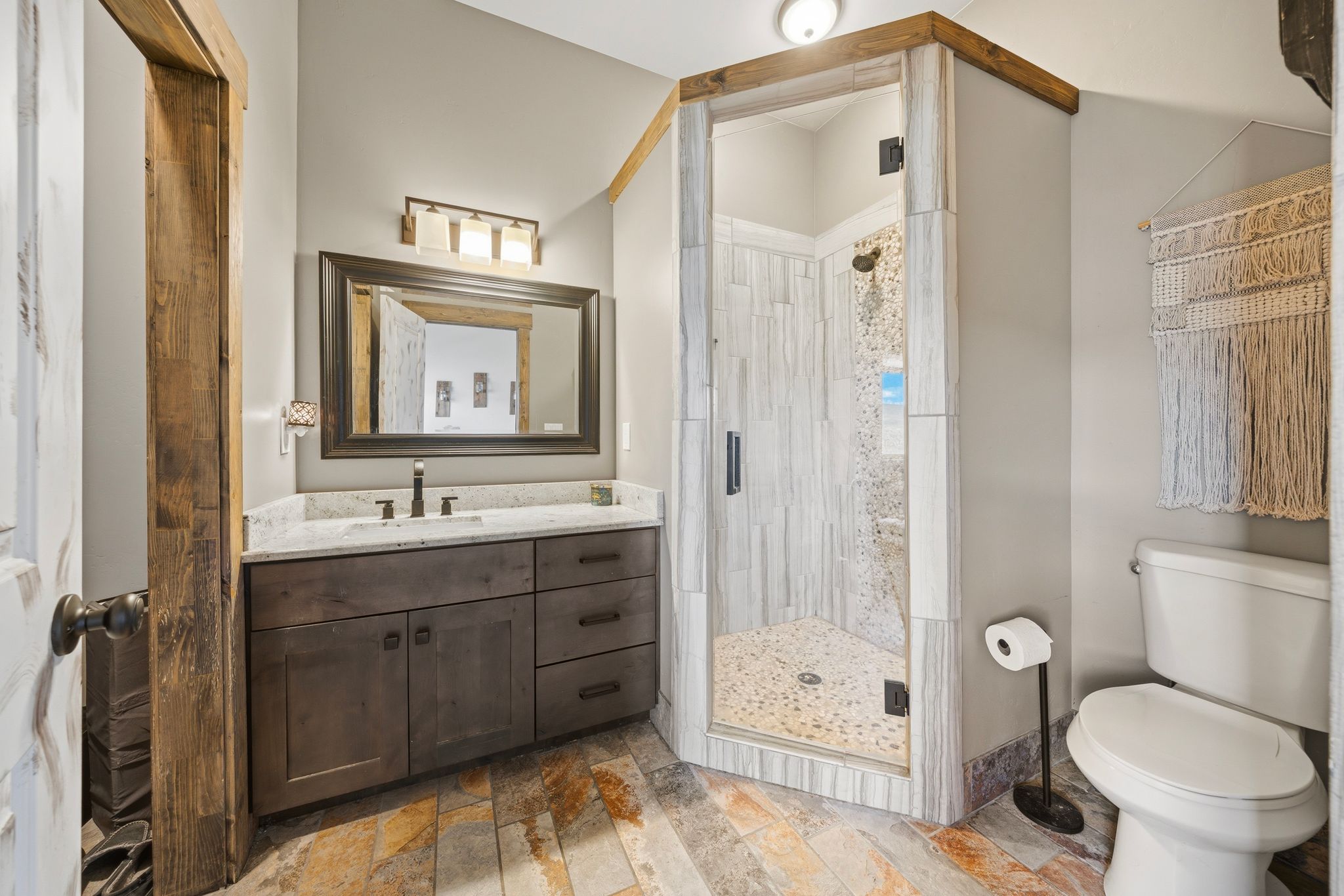 Full bath with a stall shower and vanity