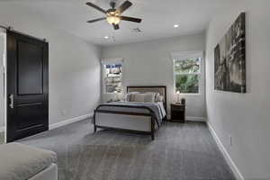Bedroom with a ceiling fan, recessed lighting, and carpet floors