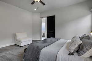 Bedroom with carpet flooring, ceiling fan, and ensuite bath