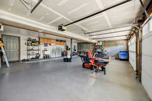 Garage with a garage door opener and a sink