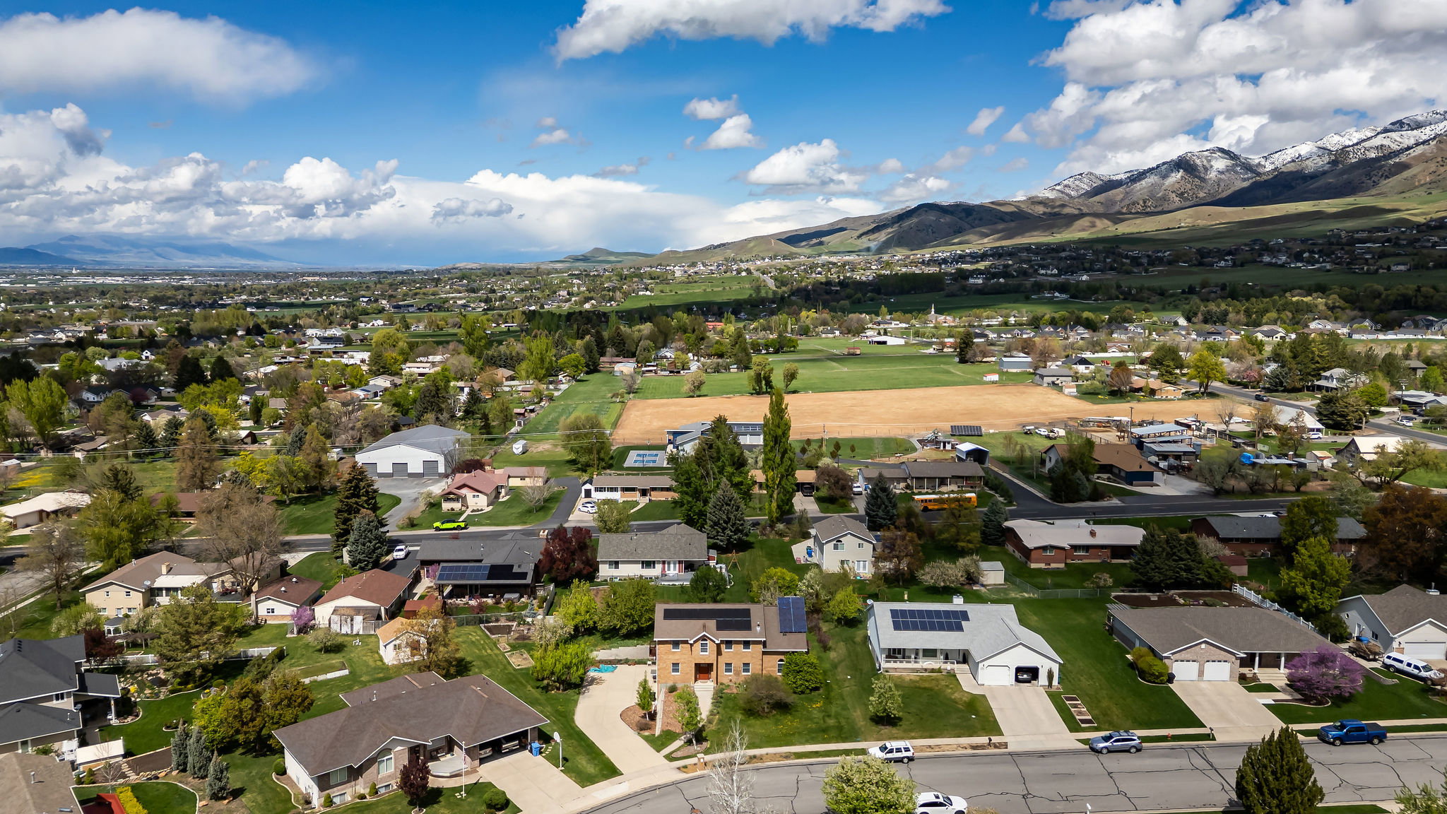 Aerial perspective of suburban area featuring a mountainous background