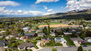 Aerial perspective of suburban area featuring a mountainous background