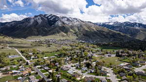 Aerial view of residential area featuring a mountainous background