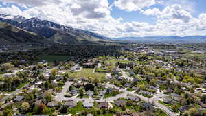 Aerial perspective of suburban area featuring a mountainous background