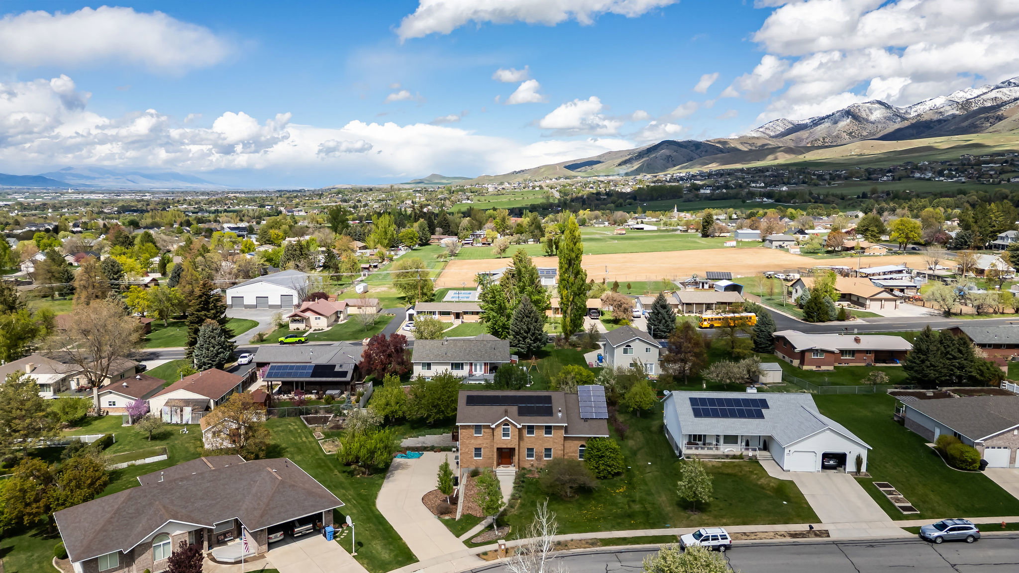 Aerial view of residential area featuring a mountainous background