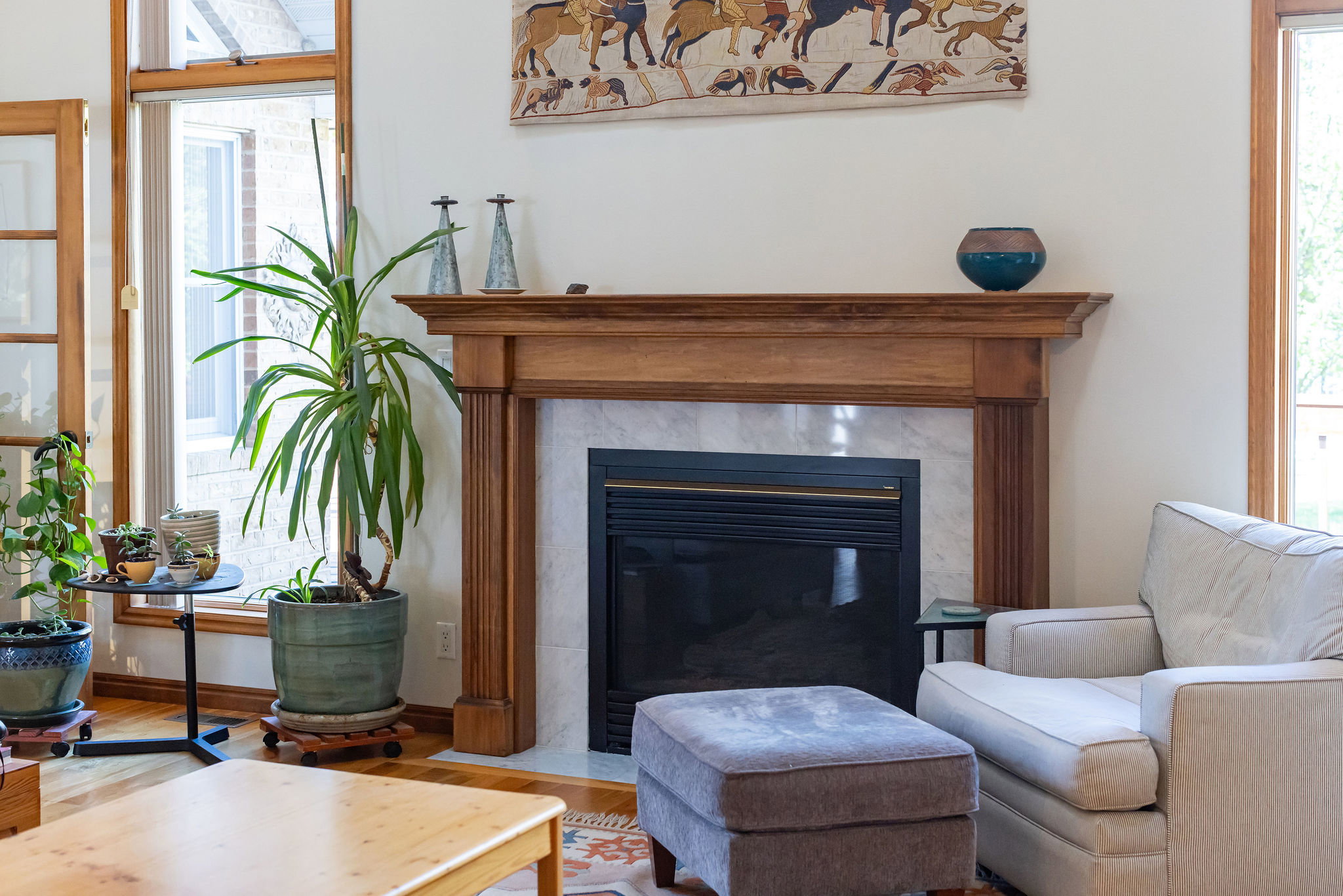 Living area with a fireplace and wood finished floors