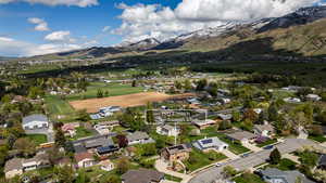 Aerial view of residential area featuring a mountainous background