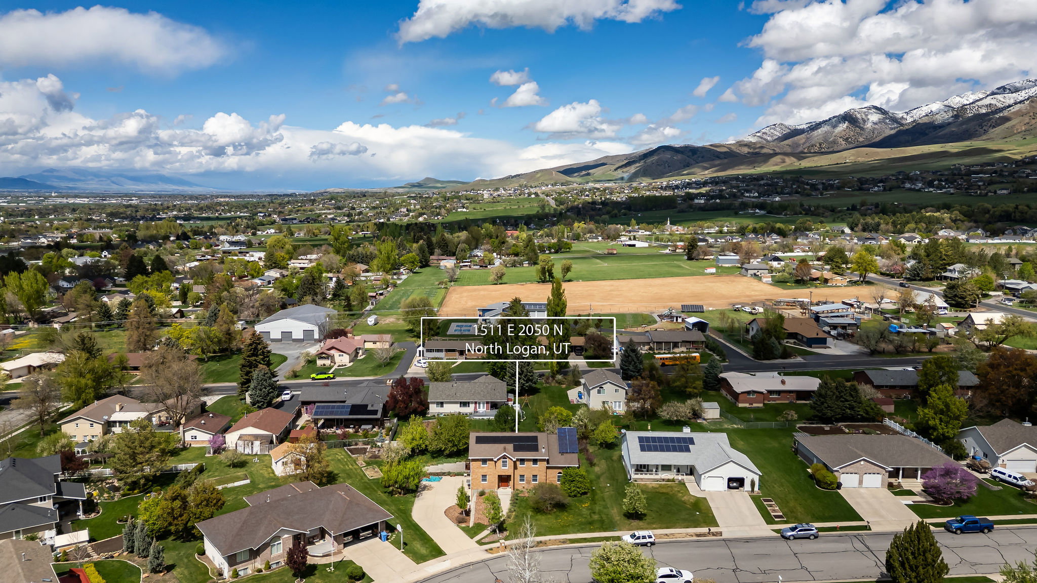 Aerial perspective of suburban area featuring a mountain backdrop
