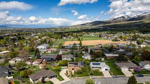 Aerial perspective of suburban area featuring a mountain backdrop