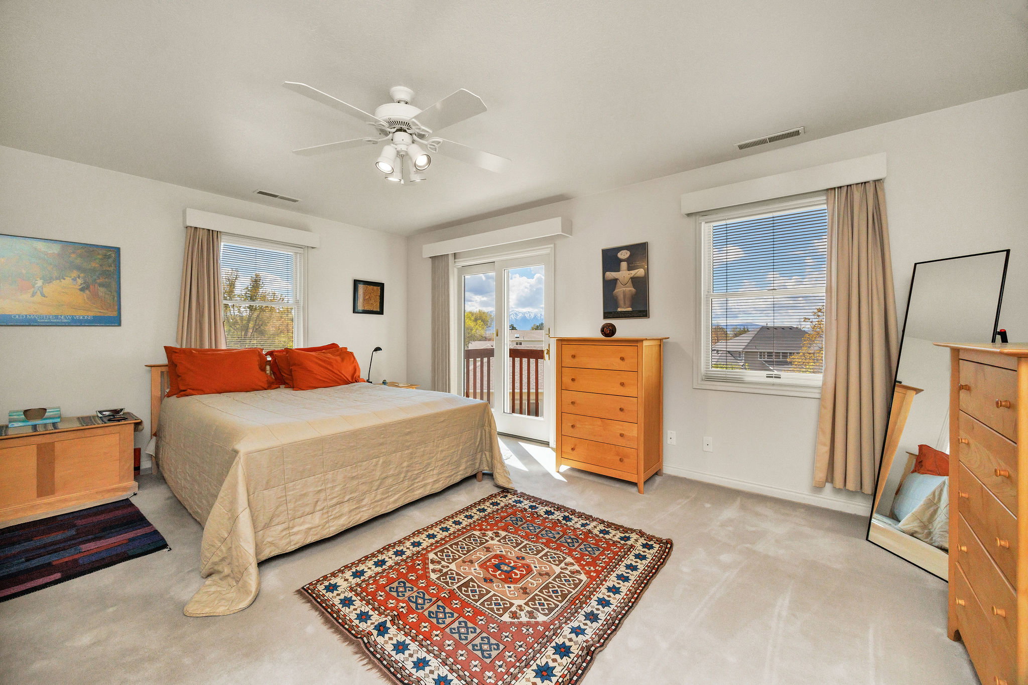 Bedroom featuring access to outside, light carpet, and ceiling fan