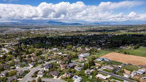 Aerial perspective of suburban area featuring a mountain backdrop