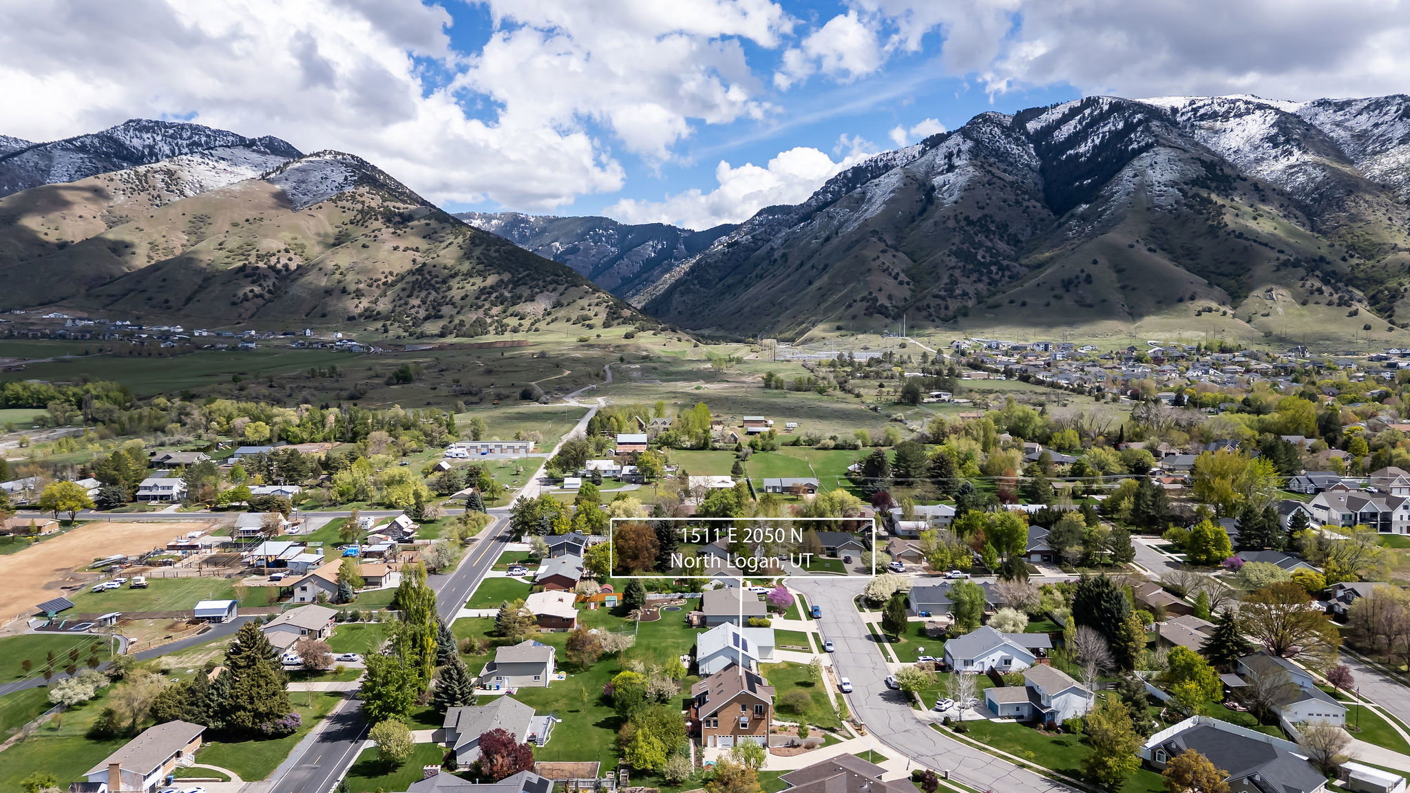 Aerial perspective of suburban area with a mountain backdrop