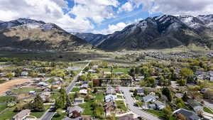 Aerial perspective of suburban area with a mountain backdrop