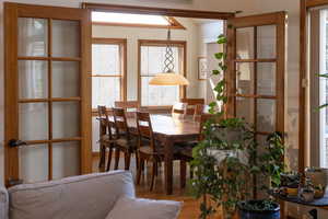 Dining room with healthy amount of natural light and wood finished floors