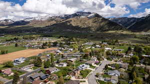 Aerial perspective of suburban area with a mountain backdrop