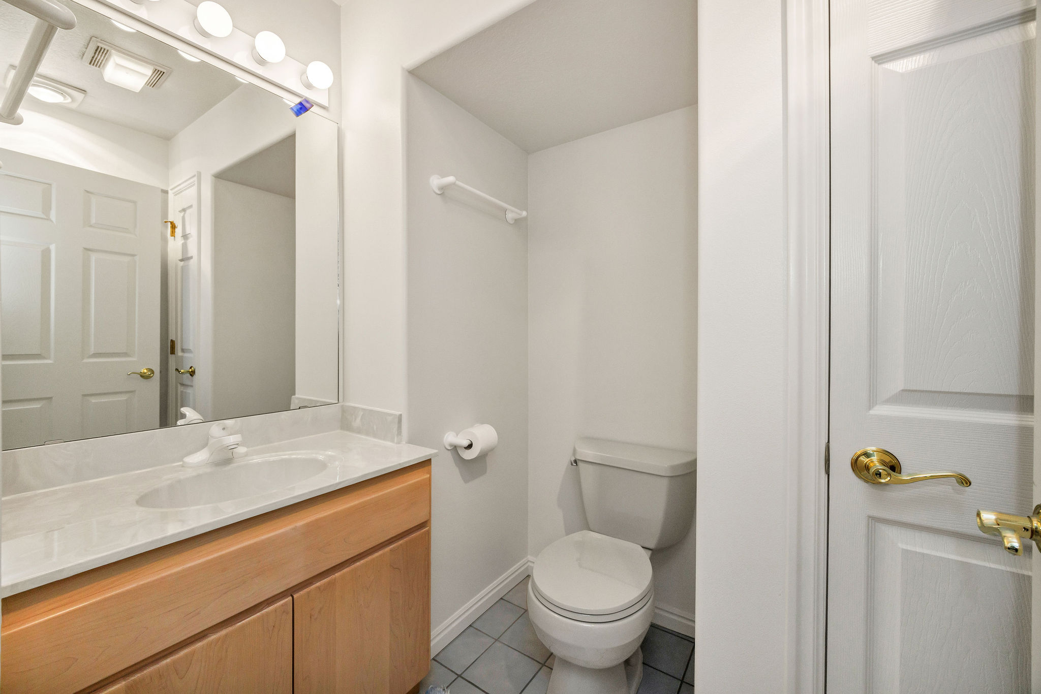 bathroom featuring vanity and light tile patterned flooring